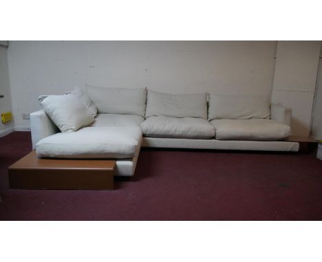 A large Flexform modular sofa, "L" shaped in three parts with fitted side table. H.75 W.325 D.230cm 