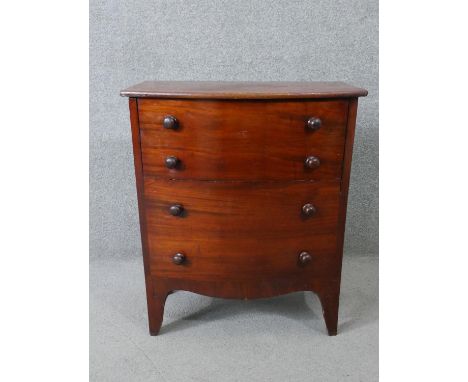 A Georgian mahogany bow fronted commode on swept supports. H.70 W.60 D.40cm 