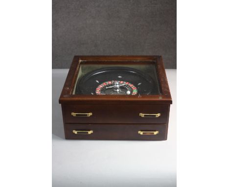 A vintage table top Roulette wheel and and complete set of bespoke coloured acrylic pearlized chips. H.18 W.39 D.37cm. 