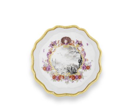 A Meissen lobed teapot stand, circa 1735-40Painted in black monochrome with a harbour scene with figure in the foreground wit