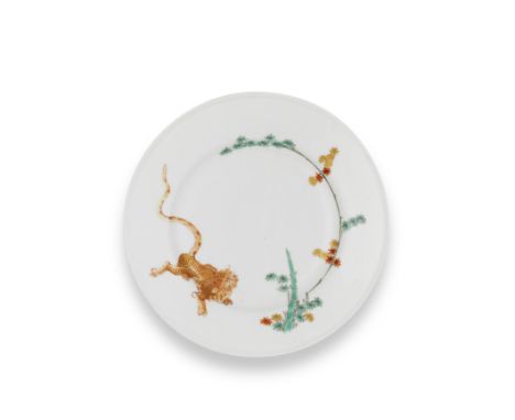 A Meissen plate from the Japanese Palace, circa 1730Painted in Kakiemon style in enamels and gilding with a tiger opposite fl