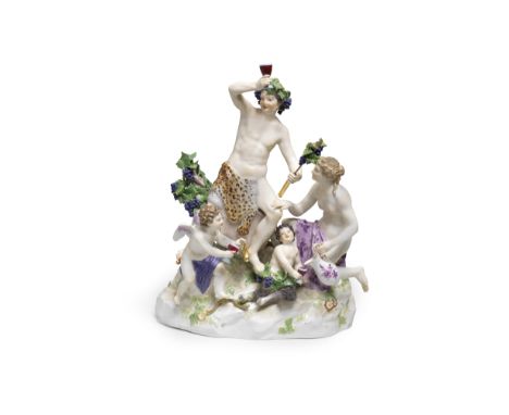 A Meissen group of Bacchus and attendants, late 19th centuryModelled by E.A. Leuteritz, Bacchus seated atop a barrel holding 