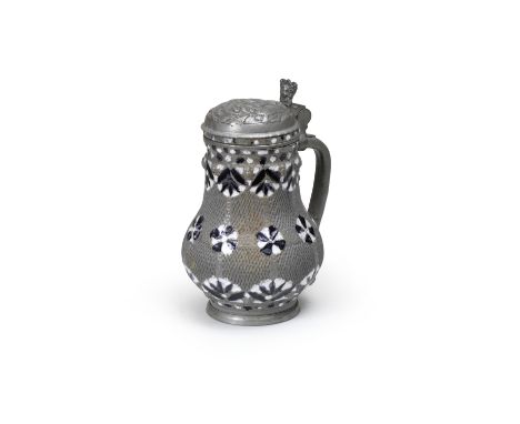A Freiberg pewter-mounted stoneware jug (Birnbauchkrug), circa 1670The pear-shaped body with a Kerbschnitt ground reserved wi