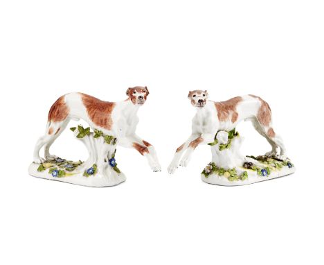 A pair of Meissen models of greyhounds, circa 1745-50Modelled by J.J. Kaendler, in the process of running supported by leafy 