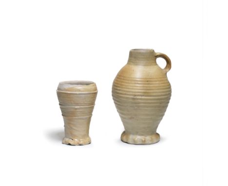 A Siegburg stoneware beaker, 15th centuryMoulded with parallel horizontal lines, the slightly splayed foot lobed, partially a