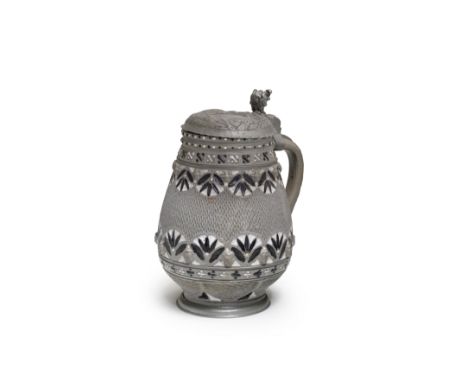 A Freiberg pewter-mounted stoneware jug, circa 1660The ovoid form with a Kerbschnitt ground between bands of foliate panels p