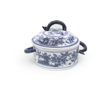 A Meissen early two-handled circular tureen and cover, circa 1725Decorated in underglaze-blue with flowering branches of indi