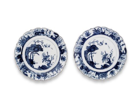 Two Meissen plates with underglaze-blue decoration, circa 1740With wavy, brown-edged rims, painted after a Chinese original w