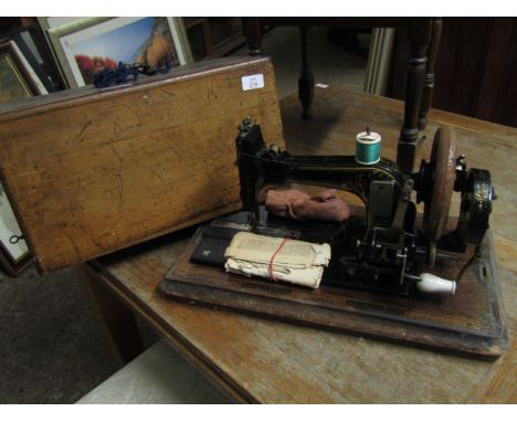 WALNUT CASED VINTAGE SEWING MACHINE 