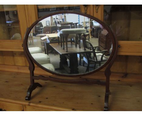 MAHOGANY FRAMED OVAL DRESSING TABLE MIRROR WITH SHAPED SUPPORTS
