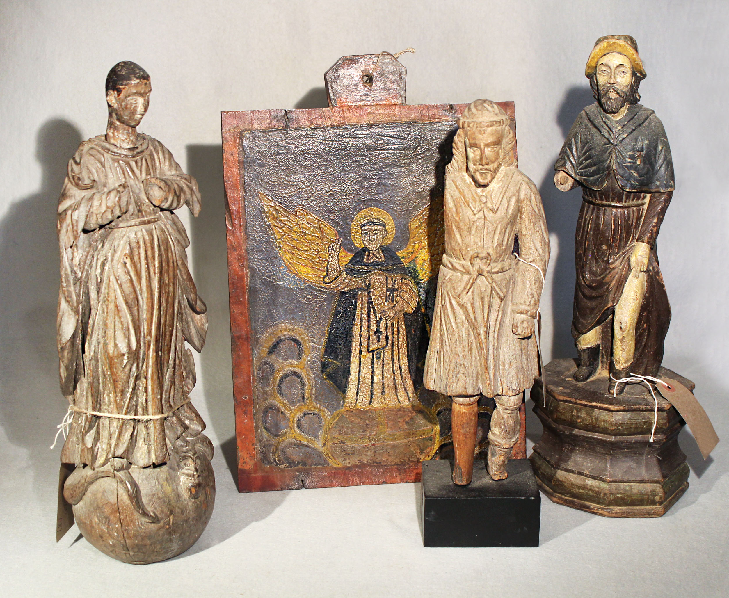 a-group-of-three-philippines-carved-wood-figures-of-saints-in