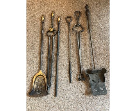 comprising tongs, poker and shovel, with brass finials 76cm together with a further set of a different design (6)Condition re