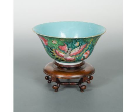painted to the exterior with three large butterflies on budded lotus leaves, with solid green ground interior, gilt rim, seal