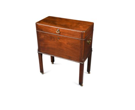 with re-entrant moulded corners and brass carrying handles, with fitted divided interior, on chamfered legs with leather cast