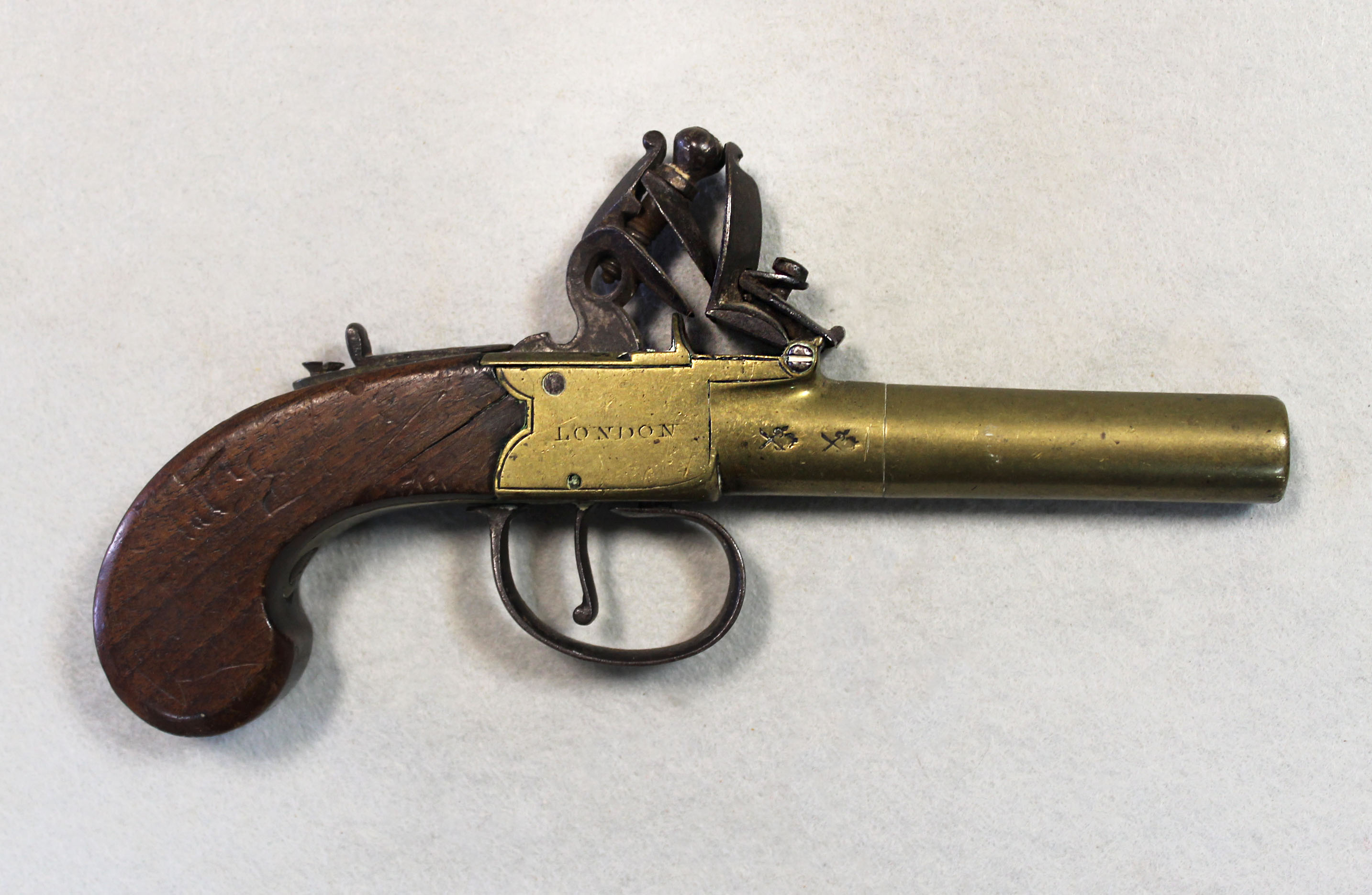 Archer London, a flintlock brass pocket pistol, in Cheffins Fine Art