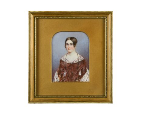 Portrait miniature of a lady, in a puce dress inscribed to the reverse 'Painted by Miss Biffin / Born without hands / Liverpo