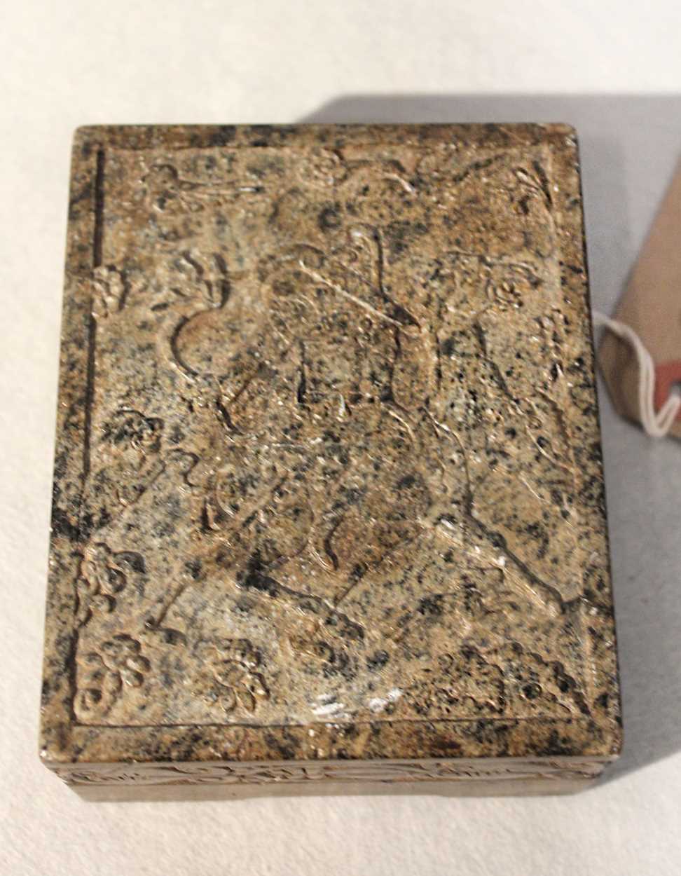 A group of three Chinese decorative stone boxes and a relief carved