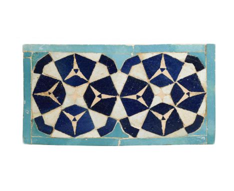with a geometric design in tones of blue and turquoise, 20 x 36cmCondition report: In my opinion this tile has been restored 