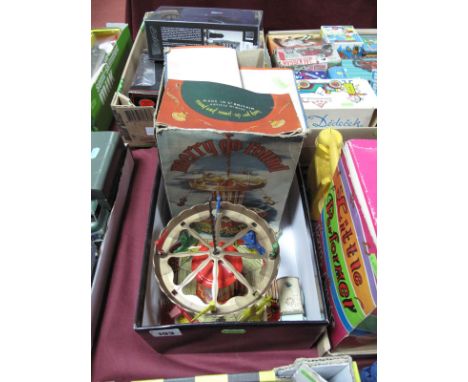 A Boxed Mettoy Tinplate and Plastic Merry Go Round No.6155, with circular and vertical motion, with a Brimtoy fly-wheel drive