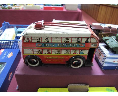 A Mid XX Century Wells Brimtoy Four Wheel Trolley Bus, clockwork, with "Buy British" adverts, some fading and signs of wear, 