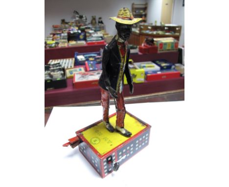 A Lehmann of Germany No. 690 "Oh My" Alabama Jigger, lithograph dancing figure on a tin base, 25cms high, overall signs of we