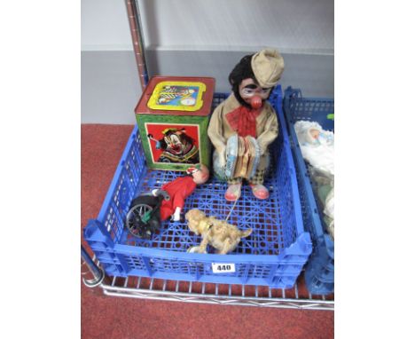 A Mid XX Century Battery Operated Clown, by Alps of Japan, with the clown playing a squeeze box and connected to a cymbal pla