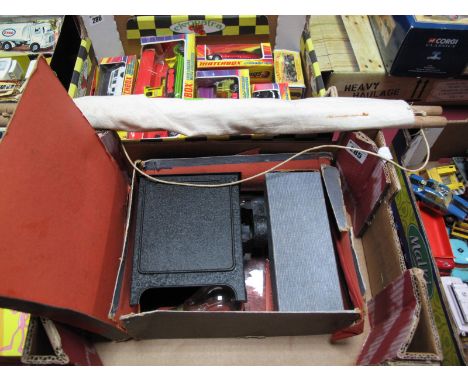 An Early XX Century Boxed Gerbruder Bing Tinplate Electric Child's Glass Plate Projector, with a box of twelve colour glass s