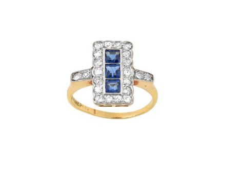 A Sapphire and Diamond Cluster Ring three square step cut sapphires within a border of old cut diamonds, in white millegrain 