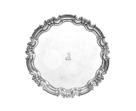 An Edward VII Silver Salver,  by William Hutton and Sons, Sheffield, 1902 shaped circular and on three leaf-capped scroll fee