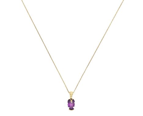 An 18 Carat Gold Amethyst and Diamond Pendant on Chainthe carved amethyst depicting two faces in profile, in yellow elongated