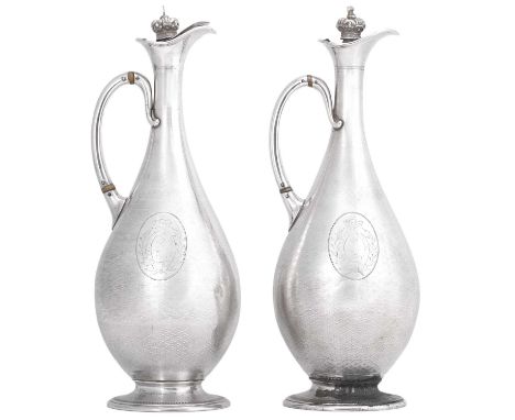 A Pair of Victorian Silver Hot-Water Jugs,  by William Hunter, London, 1863  pear-shaped and on spreading foot, overall engin