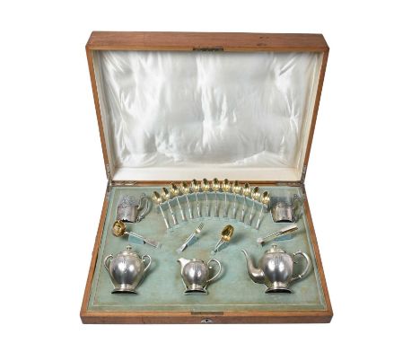 A Three-Piece Russian Silver Tea-Service and Associated Tea-Equipage,  The Tea-Service Probably by Fyedor Yartsyev, Moscow, 1