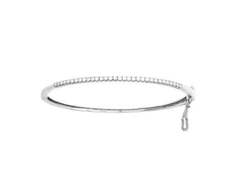 An 18 Carat White Gold Diamond Banglethe round brilliant cut diamonds in claw settings, to a plain polished hinged back, tota
