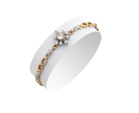A 9 Carat Gold Diamond Braceletthe central raised round brilliant cut diamond within a border of eight-cut diamonds, in white