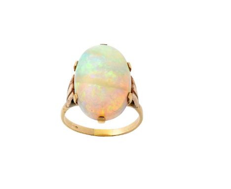 An Opal Ringthe oval cabochon opal in a yellow claw setting, to a scalloped shoulder plain polished shankfinger size QThe rin