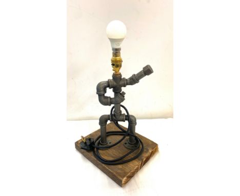 Novelty pipe lamp made from radiator fittings. Measures approx 18.5 height