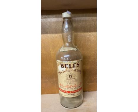 Vintage tall Bells Whiskey glass bottle with screw lid, approximate height: 19.5 inches