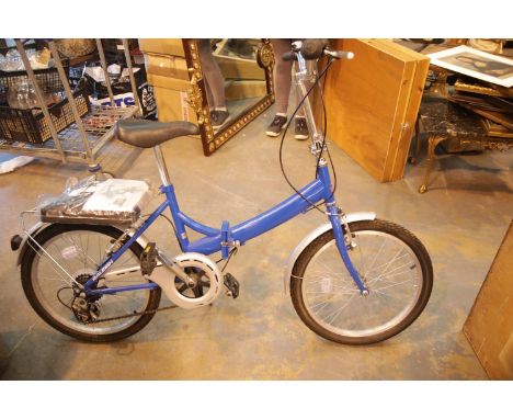 Raleigh Bikes folding ladies shopper bike with cover and tools. This lot is not available for in-house P&amp;P. 