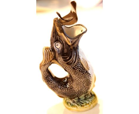 Unnamed glazed ceramic gurgle fish jug with pewter lid. This lot is not available for in-house P&amp;P. 
