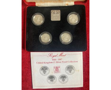 COINS 1984 - 1987 Silver £1 coin set of four cased with cert, slight foxing in box lid