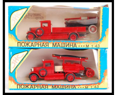 Two vintage Soviet Russian USSR OMO made 1:43 scale diecast model vehicles to include 2x different style fire trucks. Both wi