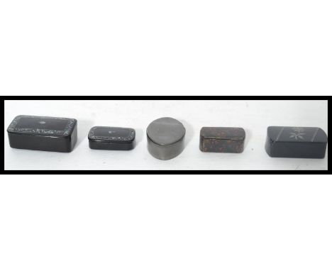 A group of snuff boxes dating from the 19th century to include a Masonic pewter box of oval form along with four papier mache