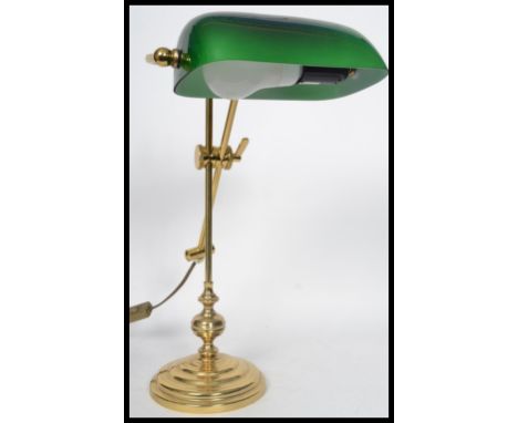 A vintage 20th century bankers desk lamp raised on an adjustable knopped column with stepped circular base. Measures 15.5 cm 