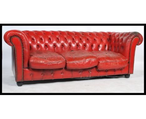 A contemporary 20th Century buttoned back&nbsp; distressed red leather upholstered three seater Chesterfield sofa.&nbsp;Measu