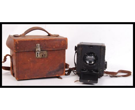 An antique Reflex /&nbsp; Dallmeyer of London made ' Press ' plate camera. Lens fitted to front, within its original leather 