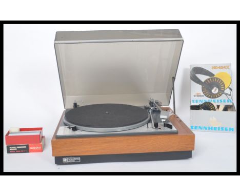 A vintage 20th century&nbsp;Lenco Goldring GL75 stereo transcription turntable, teak case with smoked lift up lid. When close