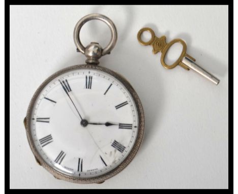 A vintage early 20th century open faced silver hallmarked Continental pocket watch, enamel face with Roman numeral chapter ri