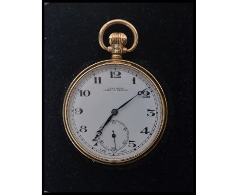 A hallmarked 9ct gold Dennison Eclipse pocket watch having a white enamel face with faceted hands and subsidiary seconds dial