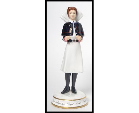 A Michael Sutty ceramic figurine of a nurse limited edition 61/250 model number 2335. Measures 20 cm high.