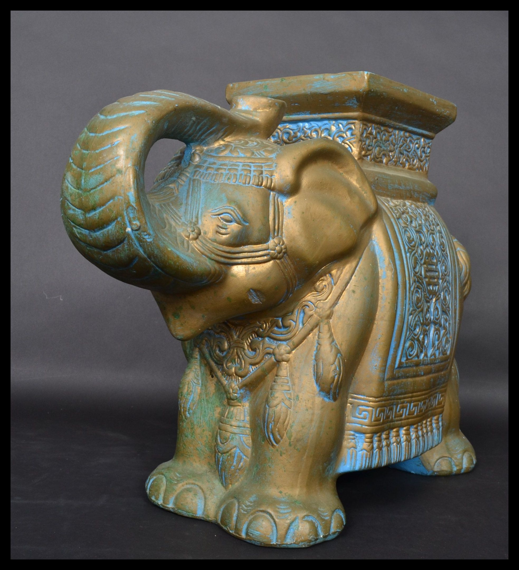 A Chinese 20th century ceramic plant stand in the form of an elephant